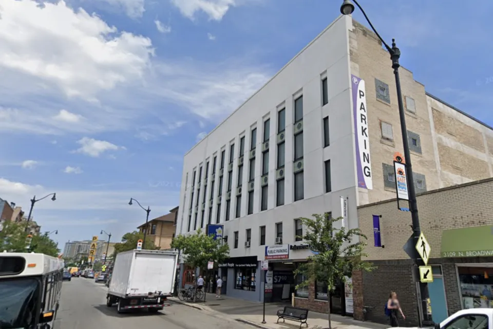 Google street view of white parking garage building in Chicago in 2018 prior to conversion to apartments